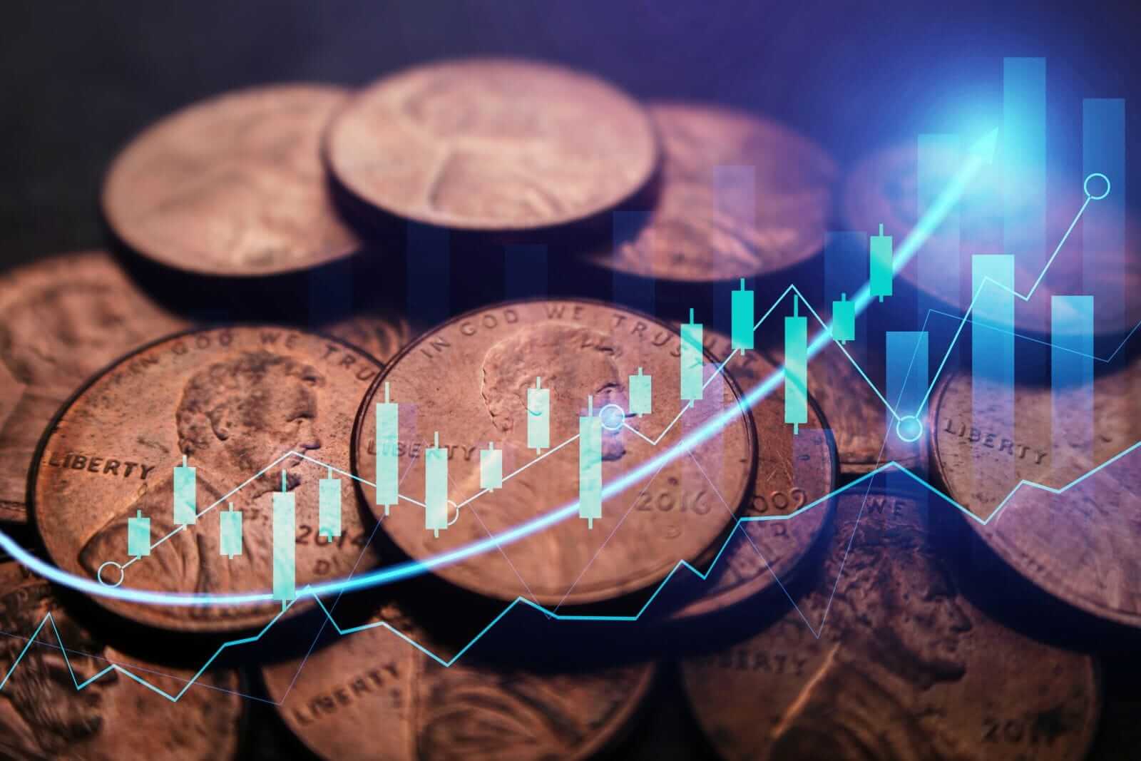 A pile of pennies with a trading chart superimposed_ Image by Shutterstock Professional via Shutterstock_